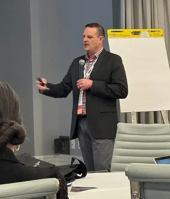 Sales Training - Man presenting at a conference.